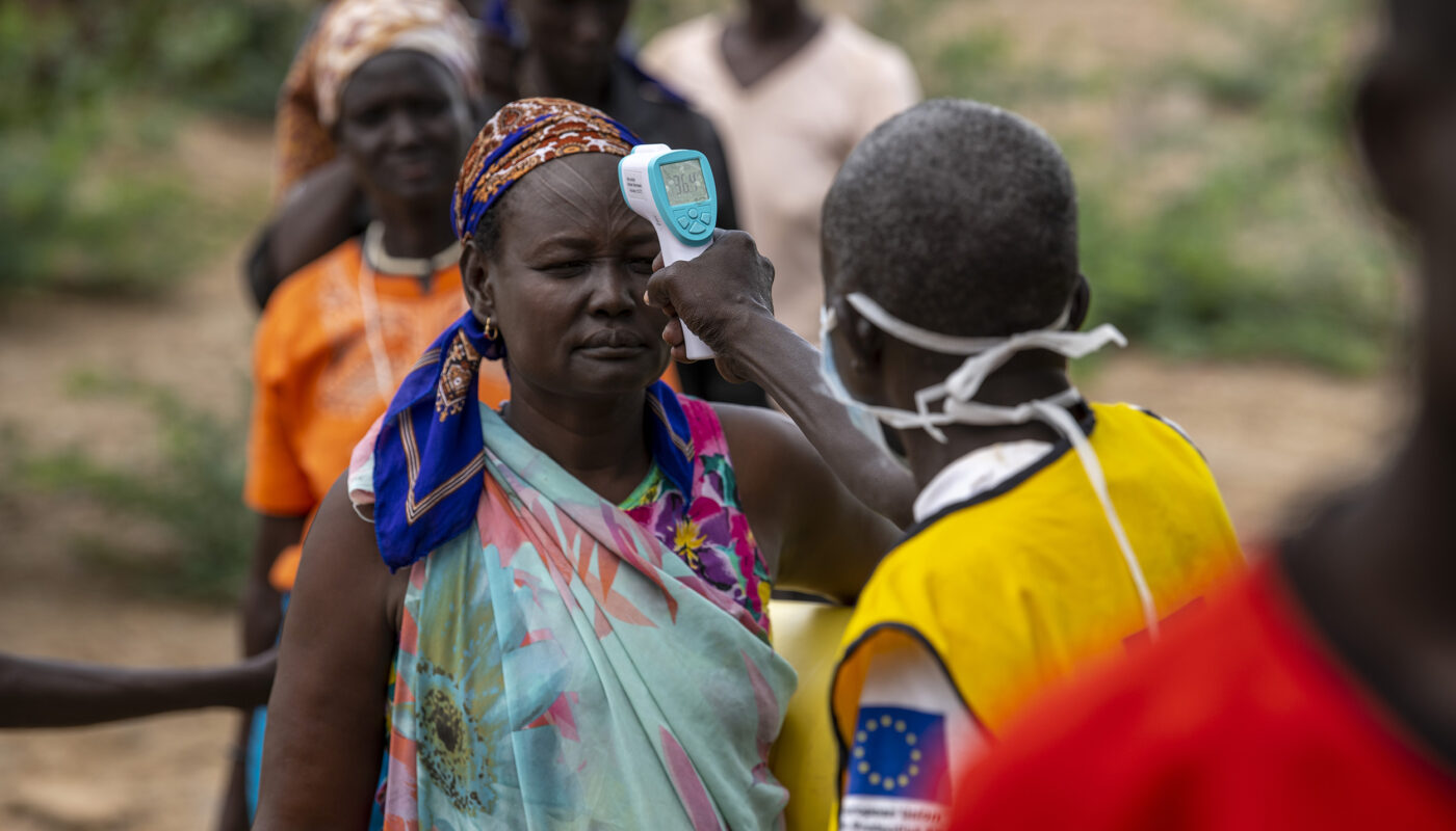 South Sudanese refugees have their temperature taken before accessing a food distribution at Kakuma camp. ; As well as a food distribution to cover two months, beginning on 1 April 2020, UNHCR is also distributing core relief items at Kakuma such as soap, jerrycans and other hygiene products. Along with our health partners, we are conducting thermal screening and promoting hygiene measures and social distancing at distribution points, in line with preventive measures against the spread of COVID-19. In early-2020, COVID-19 became a global pandemic, spreading to nearly all the world’s continents. Refugees and displaced populations, particularly the elderly and those with pre-existing health conditions, often have reduced access to health services and sanitation and may be more likely to be among the vulnerable groups at greater risk of contracting contagious viruses and communicable disease.
